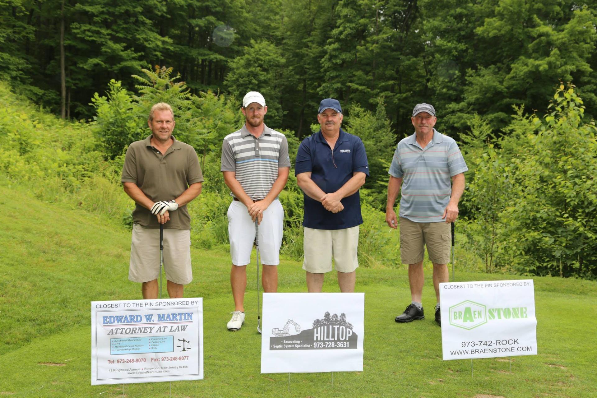 Foursome at a sponsored hole