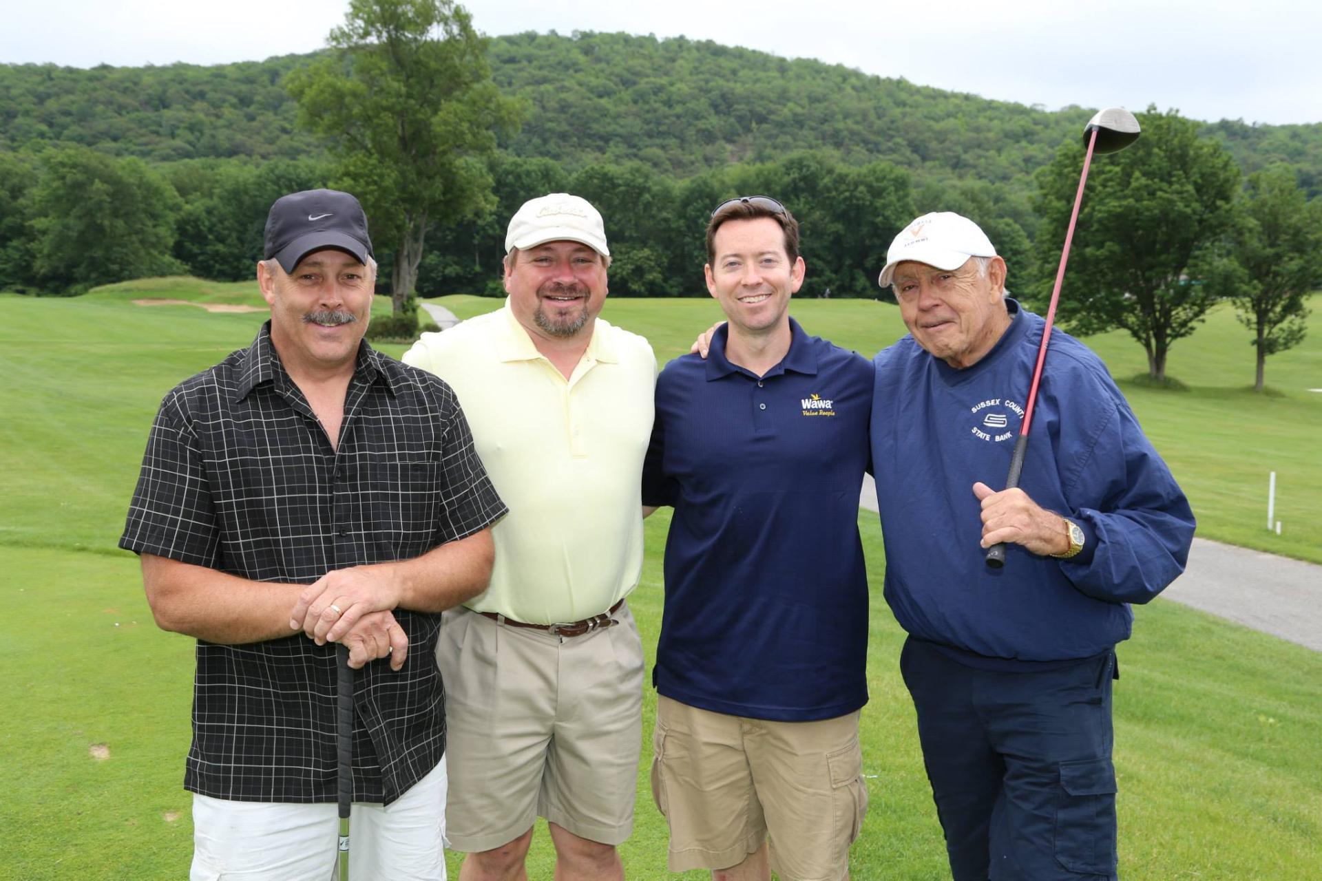 Foursome with mountain backdrop